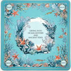 	Ocean theme mahjong playing mat with mermaid and coral design, marked East South West North