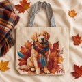 Autumn gift flat-lay mockup of a natural woven canvas tote featuring a Golden Retriever in a plaid scarf, styled with a folded scarf and fall leaves.