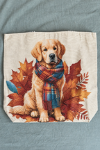 Brighter close-up product photo of a natural woven canvas tote with a Golden Retriever in a plaid scarf among autumn leaves, preserving the original artwork and texture.